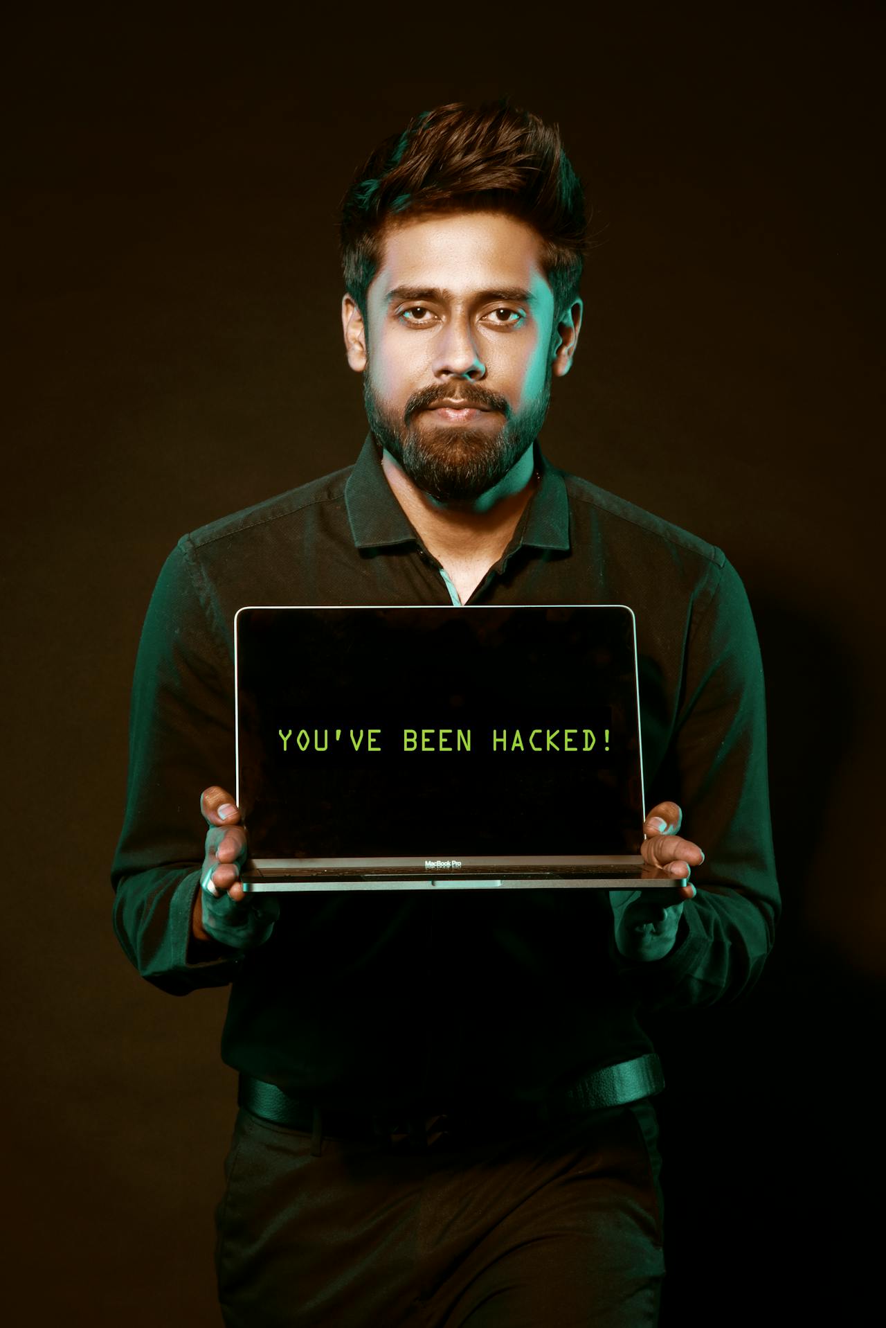 A laptop screen showing a data breach warning